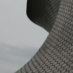 Close-up view of Museo Soumaya's futuristic hexagonal facade design.