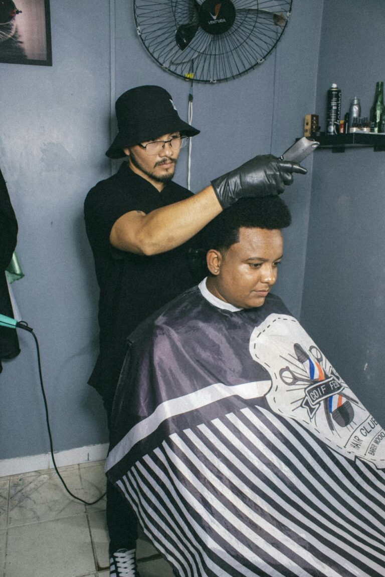 Hairdresser gives a precise haircut to a customer in Breves, Brazil salon.