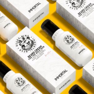 Krem-do-brody-100-ml-w-bialej-butelce-z-czarna-zakretka,-z-logo-lwa-i-napisem-BEARD-KING-IMMORTAL-na-zoltym-tle.-Butelka-stoi,-widoczne-detale-etykiety.